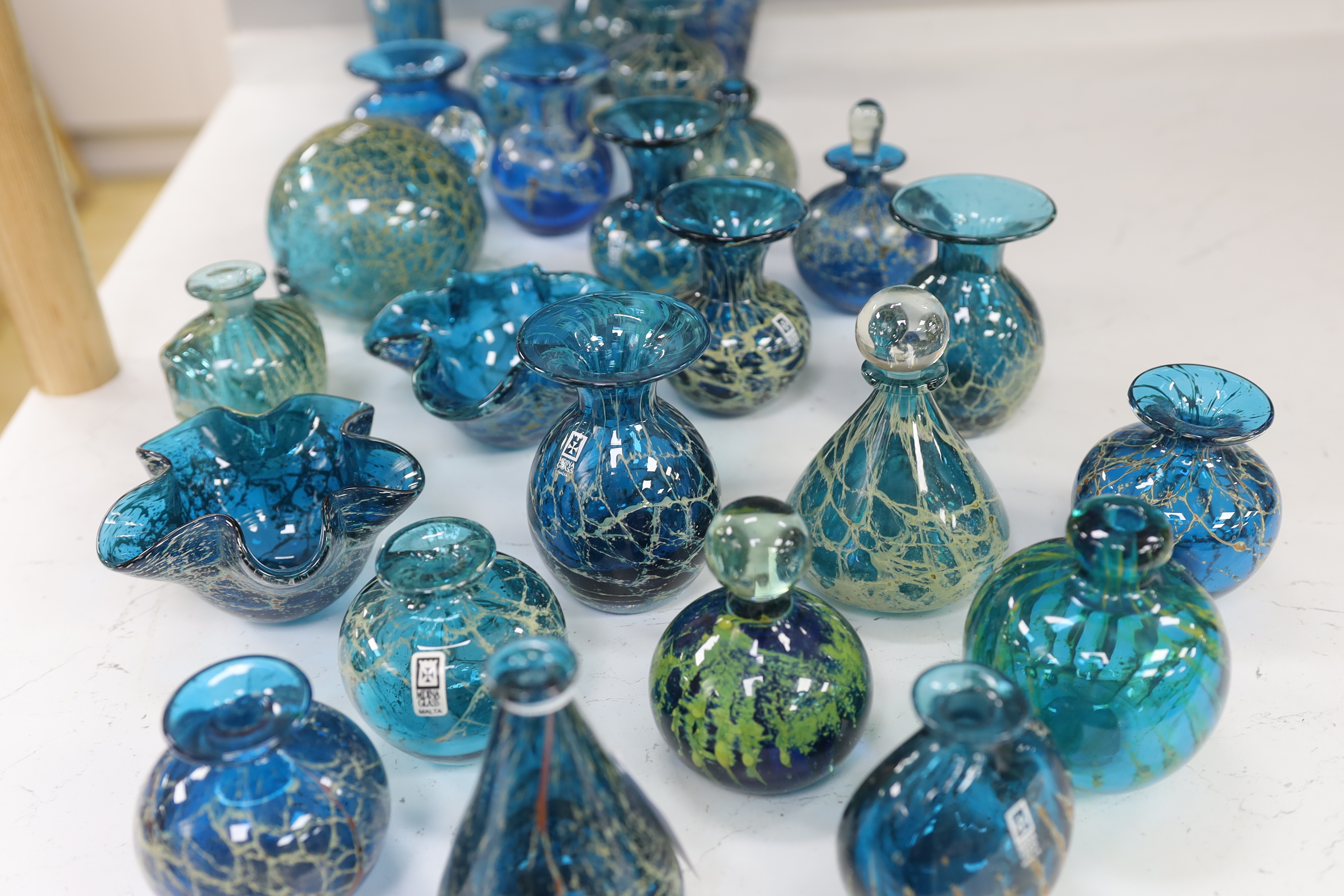 A collection of twenty five Mdina glass vases, bottles and ornaments, sea and sand colour